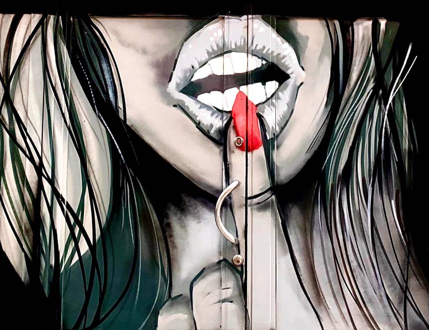 Woman with a single red nail